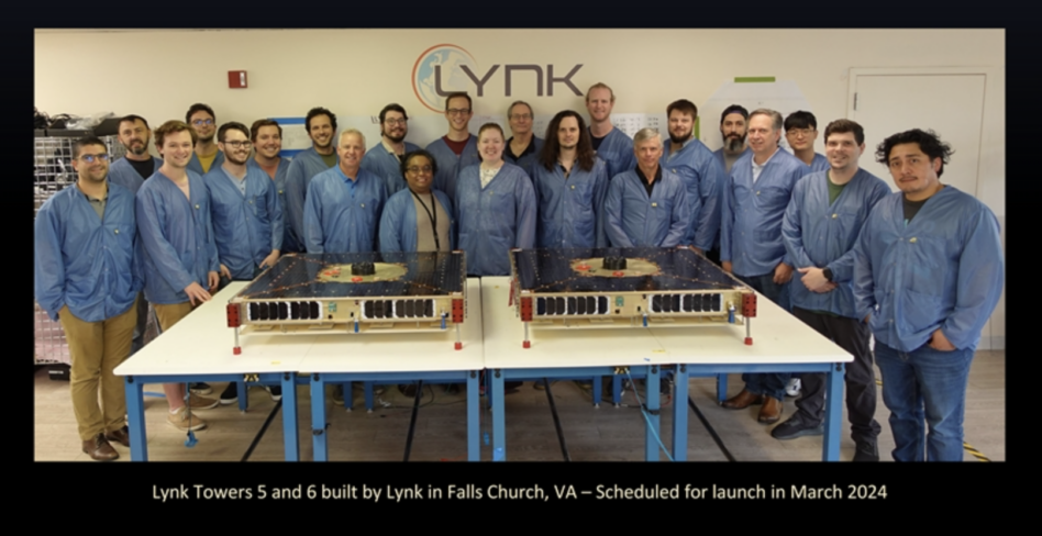 Lynk staff with two of the company's spacecraft. Image: Lynk